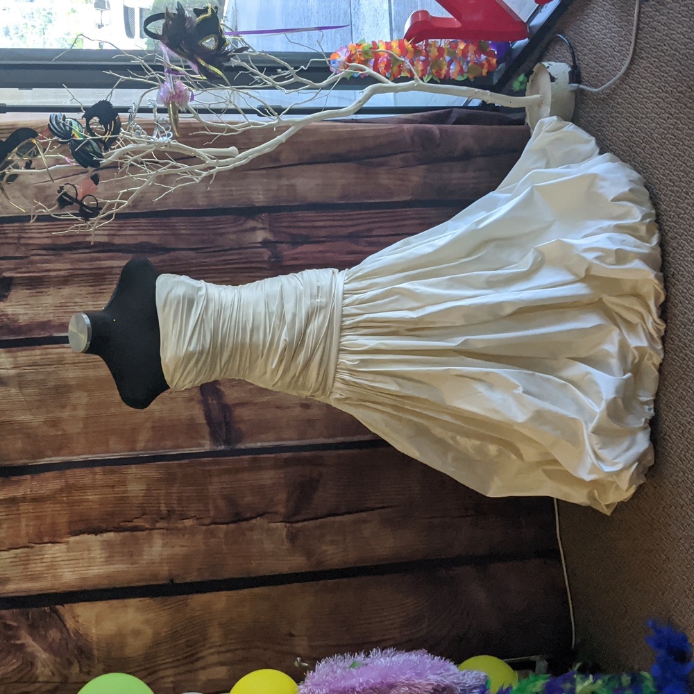 Fit and flair style wedding gown from Moisa Couture and is a size 8.